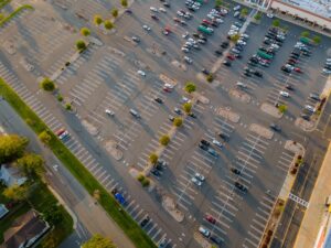 huge-parking-for-cars-near-the-shopping-center-from-the-air-on-the-parking-lot-there-are-cars